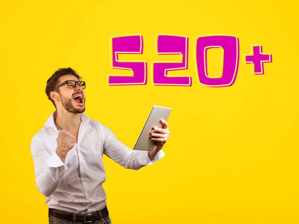 Man holding tablet with fist and excited look with the numbere 520+ in the background